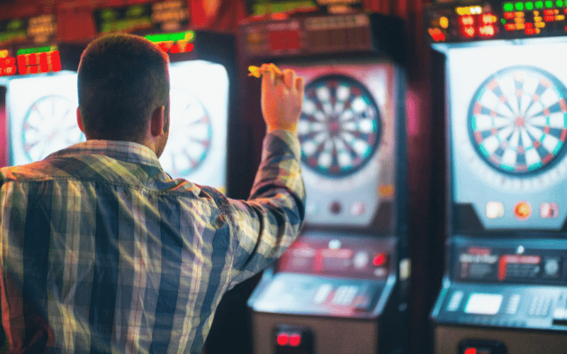 A dart player practicing physical and mental exercises for well-being